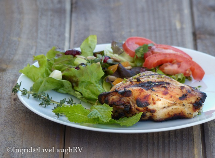 Food photograph of chicken with a side salad